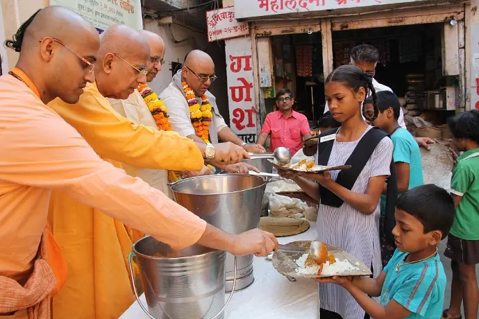 Child receiving Prasadam
