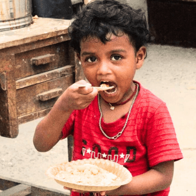 Child receiving Prasadam